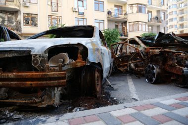 IRPIN, UKRAINE, JUNE 6, 2022: After bombing. Russian terrorist army burned cars, dwelling houses and killed people in Irpin town, Kyiv Oblast on March 2022. Terror and genocide of Ukrainian people