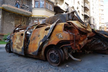 IRPIN, UKRAINE, JUNE 6, 2022: After bombing. Russian terrorist army burned cars, dwelling houses and killed people in Irpin town, Kyiv Oblast on March 2022. Terror and genocide of Ukrainian people