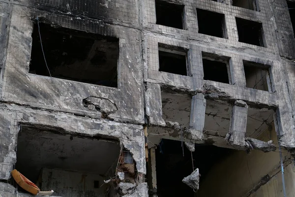 KYIV, UKRAINE, APRIL 15, 2022: After bombing. Russian terrorist army destroyed by shell dwelling house on Obolon district in Kyiv on March 2022. War in Ukraine. Terror and genocide of Ukrainian people