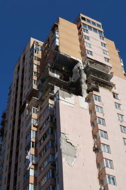 KYIV, UKRAINE, MAY 11, 2022: Russian missile damaged multi-storey dwelling building in Kiev city on February 26, 2022. Russian aggression. War in Ukraine. Terror and genocide of Ukrainian people