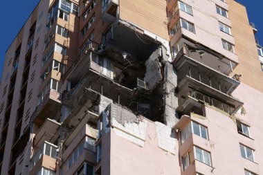 KYIV, UKRAINE, MAY 11, 2022: Russian missile damaged multi-storey dwelling building in Kiev city on February 26, 2022. Russian aggression. War in Ukraine. Terror and genocide of Ukrainian people