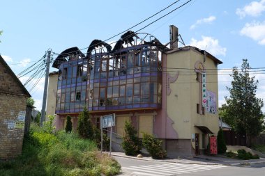 BUCHA, UKRAINE, JUNE 8, 2022: War in Ukraine. Russian army of terrorist and marauders damaged dwelling house in Bucha, Kyiv Region on March 2022. After bombing. Terror and genocide of Ukrainian people