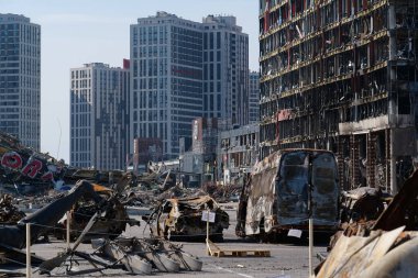 KYIV, UKRAINE, APRIL 15, 2022: Cars burned by russian missile. Missile destroyed shopping center Retroville on March 20. Terror and genocide of Ukrainian people. Russia - state of sponsor of terrorism