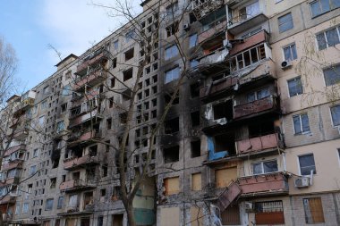 KYIV, UKRAINE, APRIL 15, 2022: After bombing. Russian terrorist army destroyed by shell dwelling house on Obolon district in Kyiv on March 2022. War in Ukraine. Terror and genocide of Ukrainian people