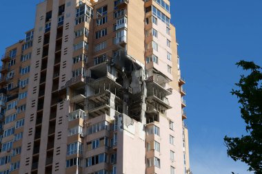 KYIV, UKRAINE, MAY 11, 2022: Russian missile damaged multi-storey dwelling building in Kiev city on February 26, 2022. Russian aggression. War in Ukraine. Terror and genocide of Ukrainian people