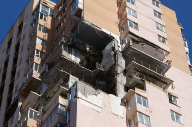 KYIV, UKRAINE, MAY 11, 2022: Russian missile damaged multi-storey dwelling building in Kiev city on February 26, 2022. Russian aggression. War in Ukraine. Terror and genocide of Ukrainian people