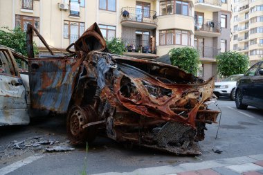 IRPIN, UKRAINE, JUNE 6, 2022: After bombing. Russian terrorist army burned cars, dwelling houses and killed people in Irpin town, Kyiv Oblast on March 2022. Terror and genocide of Ukrainian people