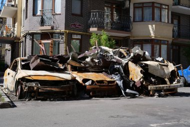 IRPIN, UKRAINE, JUNE 6, 2022: After bombing. Russian terrorist army burned cars, dwelling houses and killed people in Irpin town, Kyiv Oblast on March 2022. Terror and genocide of Ukrainian people