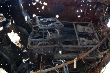 After bombing. Russian terrorist army burned cars, dwelling houses and killed people in Irpin town, Kyiv Oblast on March 2022. Terror and genocide of Ukrainian people