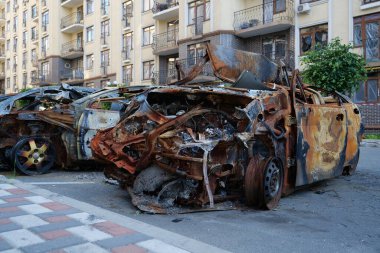 IRPIN, UKRAINE, JUNE 6, 2022: After bombing. Russian terrorist army burned cars, dwelling houses and killed people in Irpin town, Kyiv Oblast on March 2022. Terror and genocide of Ukrainian people