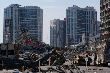 KYIV, UKRAINE, APRIL 15, 2022: Cars burned by russian missile. Missile destroyed shopping center Retroville on March 20. Terror and genocide of Ukrainian people. Russia - state of sponsor of terrorism