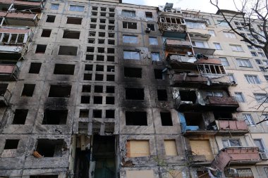 KYIV, UKRAINE, APRIL 15, 2022: After bombing. Russian terrorist army destroyed by shell dwelling house on Obolon district in Kyiv on March 2022. War in Ukraine. Terror and genocide of Ukrainian people