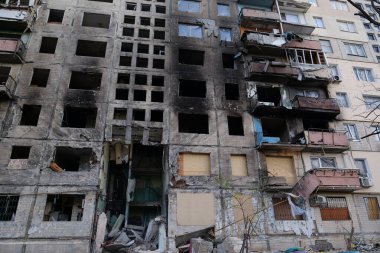 KYIV, UKRAINE, APRIL 15, 2022: After bombing. Russian terrorist army destroyed by shell dwelling house on Obolon district in Kyiv on March 2022. War in Ukraine. Terror and genocide of Ukrainian people