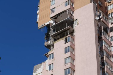 KYIV, UKRAINE, MAY 11, 2022: After bombing. War in Ukraine. Terror and genocide of Ukrainian people. Russian terrorists damaged by missile dwelling house in Kyiv on end of February 2022