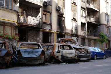 IRPIN, UKRAINE, JUNE 6, 2022: After bombing. Russian terrorist army burned cars, dwelling houses and killed people in Irpin town, Kyiv Oblast on March 2022. Terror and genocide of Ukrainian people