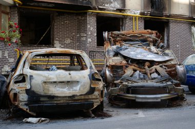 IRPIN, UKRAINE, JUNE 6, 2022: After bombing. Russian terrorist army burned cars, dwelling houses and killed people in Irpin town, Kyiv Oblast on March 2022. Terror and genocide of Ukrainian people