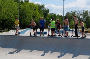 KYIV, UKRAINE, JULY 26, 2022: Childrens rides scooters at new open air sport zone at expo center of Ukraine, permanent multi-purpose exhibition complex in Teremky neighborhood of Kyiv, Ukraine