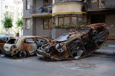 IRPIN, UKRAINE, JUNE 6, 2022: After bombing. Russian terrorist army burned cars, dwelling houses and killed people in Irpin town, Kyiv Oblast on March 2022. Terror and genocide of Ukrainian people