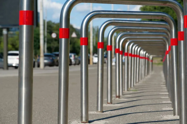 Cycle parking rack, outdoor parking place for bicycles and other vehicles. Parking of bicycles at the city street