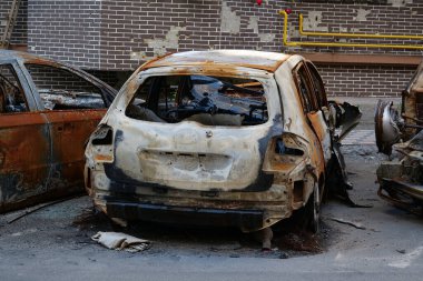 IRPIN, UKRAINE, JUNE 6, 2022: After bombing. Russian terrorist army burned cars, dwelling houses and killed people in Irpin town, Kyiv Oblast on March 2022. Terror and genocide of Ukrainian people