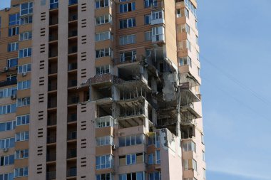 KYIV, UKRAINE, MAY 11, 2022: Russian missile damaged multi-storey dwelling building in Kiev city on February 26, 2022. Russian aggression. War in Ukraine. Terror and genocide of Ukrainian people