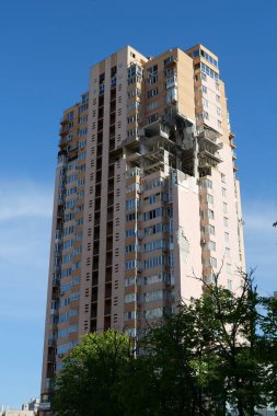 KYIV, UKRAINE, MAY 11, 2022: After bombing. War in Ukraine. Terror and genocide of Ukrainian people. Russian terrorists damaged by missile dwelling house in Kyiv on end of February 2022
