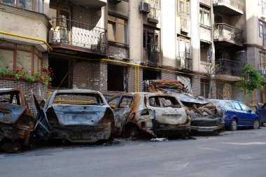 IRPIN, UKRAINE, JUNE 6, 2022: After bombing. Russian terrorist army burned cars, dwelling houses and killed people in Irpin town, Kyiv Oblast on March 2022. Terror and genocide of Ukrainian people