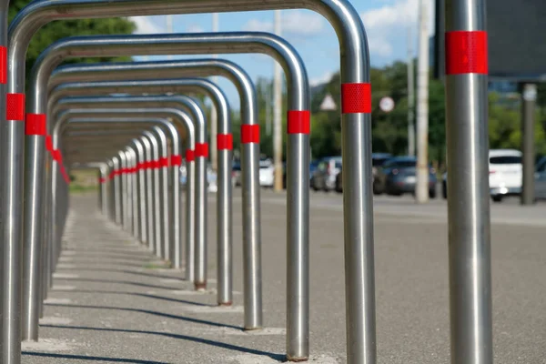 Cycle parking rack, outdoor parking place for bicycles and other vehicles. Parking of bicycles at the city street