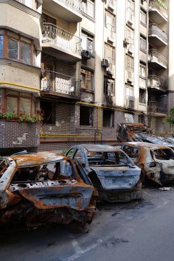 IRPIN, UKRAINE, JUNE 6, 2022: After bombing. Russian terrorist army burned cars, dwelling houses and killed people in Irpin town, Kyiv Oblast on March 2022. Terror and genocide of Ukrainian people