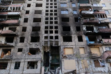 KYIV, UKRAINE, APRIL 15, 2022: After bombing. Russian terrorist army destroyed by shell dwelling house on Obolon district in Kyiv on March 2022. War in Ukraine. Terror and genocide of Ukrainian people