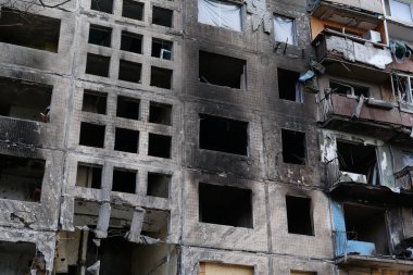 KYIV, UKRAINE, APRIL 15, 2022: After bombing. Russian terrorist army destroyed by shell dwelling house on Obolon district in Kyiv on March 2022. War in Ukraine. Terror and genocide of Ukrainian people