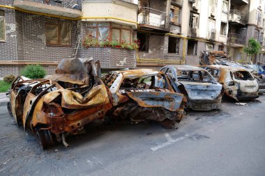 IRPIN, UKRAINE, JUNE 6, 2022: After bombing. Russian terrorist army burned cars, dwelling houses and killed people in Irpin town, Kyiv Oblast on March 2022. Terror and genocide of Ukrainian people