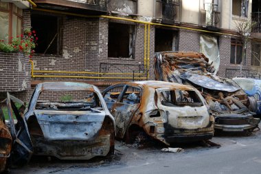 IRPIN, UKRAINE, JUNE 6, 2022: After bombing. Russian terrorist army burned cars, dwelling houses and killed people in Irpin town, Kyiv Oblast on March 2022. Terror and genocide of Ukrainian people