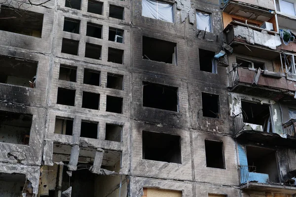 KYIV, UKRAINE, APRIL 15, 2022: After bombing. Russian terrorist army destroyed by shell dwelling house on Obolon district in Kyiv on March 2022. War in Ukraine. Terror and genocide of Ukrainian people