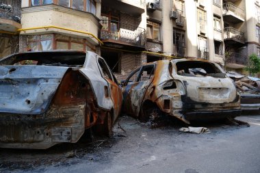 IRPIN, UKRAINE, JUNE 6, 2022: After bombing. Russian terrorist army burned cars, dwelling houses and killed people in Irpin town, Kyiv Oblast on March 2022. Terror and genocide of Ukrainian people