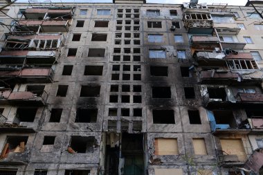 KYIV, UKRAINE, APRIL 15, 2022: After bombing. Russian terrorist army destroyed by shell dwelling house on Obolon district in Kyiv on March 2022. War in Ukraine. Terror and genocide of Ukrainian people
