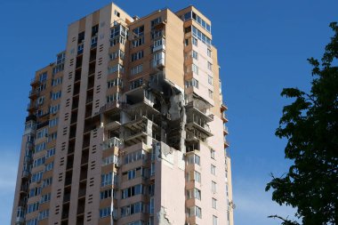 KYIV, UKRAINE, MAY 11, 2022: Russian missile damaged multi-storey dwelling building in Kiev city on February 26, 2022. Russian aggression. War in Ukraine. Terror and genocide of Ukrainian people