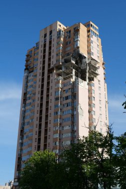 KYIV, UKRAINE, MAY 11, 2022: Russian missile damaged multi-storey dwelling building in Kiev city on February 26, 2022. Russian aggression. War in Ukraine. Terror and genocide of Ukrainian people