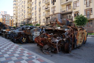 IRPIN, UKRAINE, JUNE 6, 2022: After bombing. Russian terrorist army burned cars, dwelling houses and killed people in Irpin town, Kyiv Oblast on March 2022. Terror and genocide of Ukrainian people