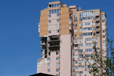 KYIV, UKRAINE, MAY 11, 2022: After bombing. War in Ukraine. Terror and genocide of Ukrainian people. Russian terrorists damaged by missile dwelling house in Kyiv on end of February 2022