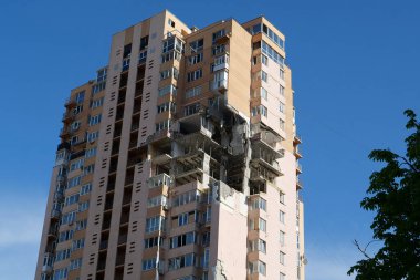 KYIV, UKRAINE, MAY 11, 2022: After bombing. War in Ukraine. Terror and genocide of Ukrainian people. Russian terrorists damaged by missile dwelling house in Kyiv on end of February 2022