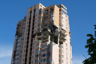 KYIV, UKRAINE, MAY 11, 2022: After bombing. War in Ukraine. Terror and genocide of Ukrainian people. Russian terrorists damaged by missile dwelling house in Kyiv on end of February 2022