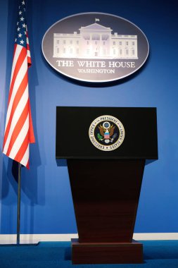 WASHINGTON, USA, OCTOBER 1, 2022: Executive office of President of United States in White House. Podium speaker tribune with National flag of United States of America