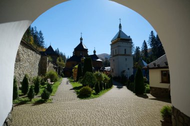 Manyava Skete of Exaltation of Holy Cross in the forest in Carpathian mountains, Ukraine. Orthodox solitary cell mens monastery, skete. Near skete in wood there is Blessed Stone, object of worship