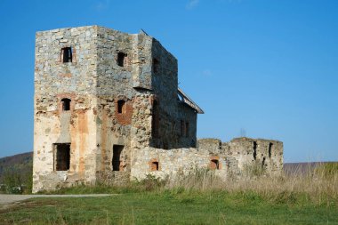 Ancient stone tower, turret in Pniv Castle - medieval historical object in Ivano-Frankivsk region of western Ukraine