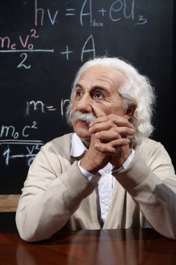 UKRAINE, BUKOVEL, OCTOBER 13, 2022: World-famous scientist, Nobel laureate, theoretical physicist, creator of theory of relativity Albert Einstein, who sits at the table