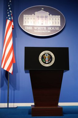 WASHINGTON, USA, OCTOBER 1, 2022: Executive office of President of United States in White House. Podium speaker tribune with National flag of United States of America