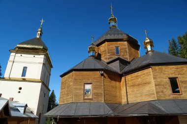 Manyava Skete of Exaltation of Holy Cross in the forest in Carpathian mountains, Ukraine. Orthodox solitary cell mens monastery, skete. Near skete in wood there is Blessed Stone, object of worship
