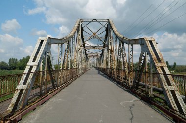 Old metal bridge across the Dniester river in the city of Galich or Halych, western Ukraine