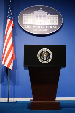 USA, WASHINGTON, OCTOBER 1, 2022: Executive office of the President of United States in White House. Podium speaker tribune with National flag of United States of America